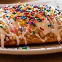 Blueberry Poptart · Homemade with blueberry filling. Smothered in frosting and sprinkles.