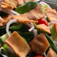 Fatoush Salad · Fresh salad mix, tomatoes, onions, cucumber, pita chips, and our olive oil house dressing an...