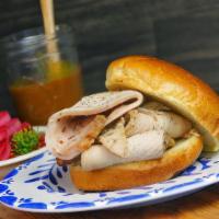 Smoked Turkey Sandwich · Hand carved-spiced turkey breast, choice of sauce on a Kaiser roll