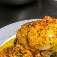 Crabby Benny · Poached egg with sauteed spinach and a crab cake seated on an English muffin garnished with ...