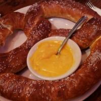 Bavarian Pretzel · One and a half pound warm Bavarian pretzel served with sides of Merkts sharp cheddar cheese ...