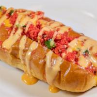 Prime Dog · Beef hot dog, jalapenos, cheetos, nacho cheese, and prime sauce.