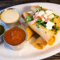 Chicken Flautas · Chicken and cheese flauta with, Queso, salsa, and Verde sauce,