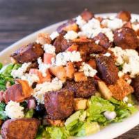 Black And Blue Salad · Seasoned steak tips, bacon, blue cheese crumbles.