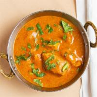 Chicken Tikka Masala · Boneless cubes of chicken breast roasted in tandoori oven and then braised in a onion and to...