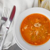 Sopa De Pollo Bowl · Bowl of homemade warm chicken soup with fresh chicken and vegetables.