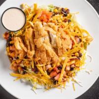 Southwest Chicken Salad · Breaded chicken strips, mixed cheeses, tomatoes, tortilla strips and black bean roasted corn...