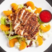 Chicken Pecan Salad · Pecan crusted chicken, mandarin oranges, red onion and sun-dried cranberries, served with ra...