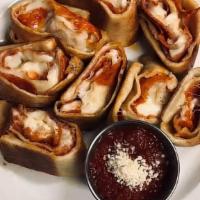 Pepperoni Rolls · Cheesy pepperoni stuffed pizza bites topped with Parmesan.