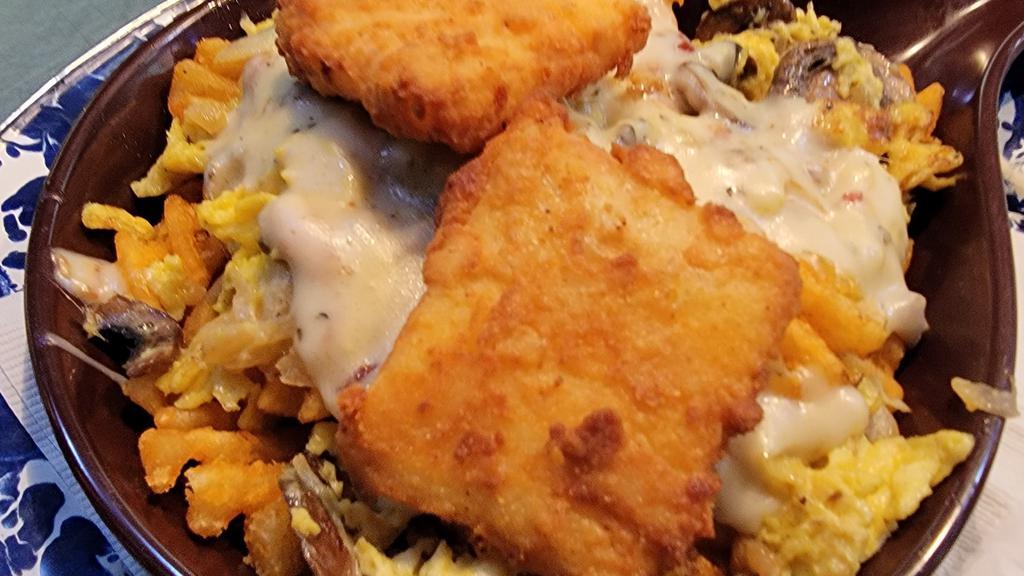 Breakfast Poutine *New* · Waffle fries topped with scrambled eggs, mushrooms, and onions. Smothered in bacon sausage breakfast gravy and garnished with 2 of Jethro's signature fried cheese squares