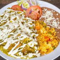 Chilaquiles · Tortilla wedges topped with green or red sauce, queso fresco and sourcream. Served with rice...