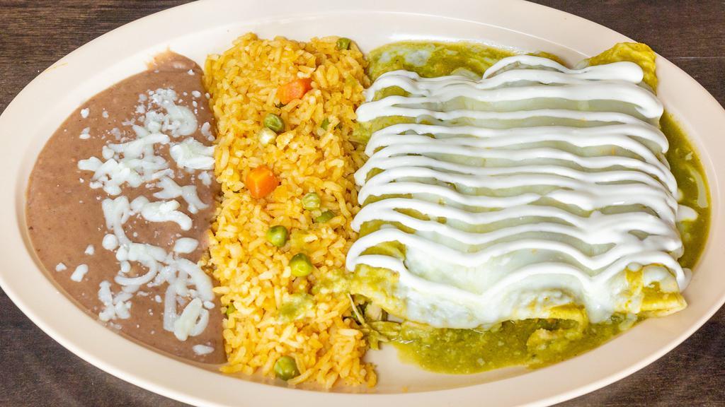 Enchiladas · Three chicken, steak or cheese enchiladas, topped with green or red sauce, cheese and cream. Served withre fried beans and red rice.