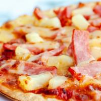 Tomahawk Hawaiian · Our fresh, made daily pizza dough topped with loads of Canadian bacon, sweet pineapple chunk...