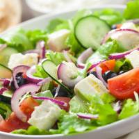 The Greek Salad · Crisp romaine lettuce, fresh cucumbers, ripe tomatoes, black olives and tangy feta cheese wi...