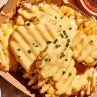 Cheese Fries · Waffle fries, cheese sauce, garlic salt, parsley