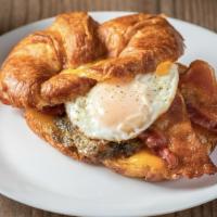 Breakfast Sandwich · Home-made sausage or bacon, egg, cheddar cheese and tomato.