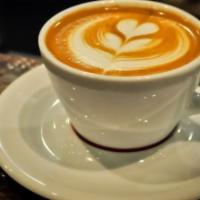 Dulce De Leche Latte · Signature drink- Double shot espresso, caramelized milk, Cajeta infused syrupy  with steam m...