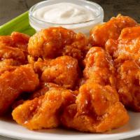 Boneless Wings · Crispy breaded chicken tossed in buffalo sauce.     Served with celery and bleu cheese or ra...