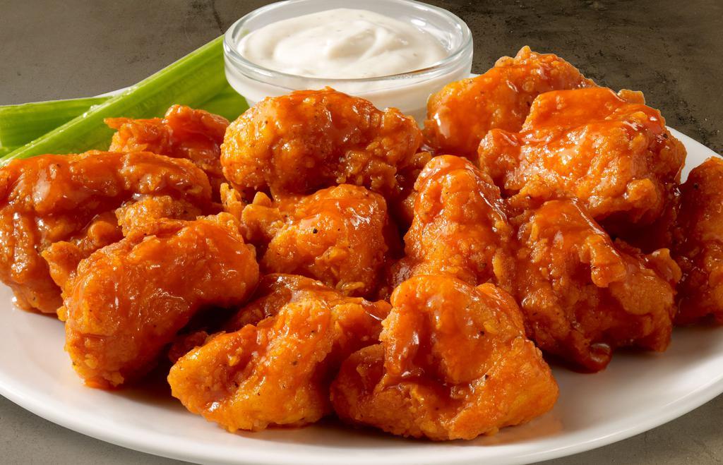 Boneless Wings · Crispy breaded chicken tossed in buffalo sauce.     Served with celery and bleu cheese or ranch dressing.