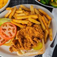 Chicken Fried Chicken Sandwich · Fried chicken on a bun! Served with  lettuce, tomato, pickle, onion and mayo on a Ciabatta bun