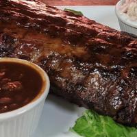 Full Rack Baby Back Ribs  · High quality baby back ribs dry rubbed and cooked on our open fire rotisserie!
