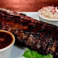 1/2 Baby Back Ribs  · High quality baby back ribs dry rubbed and cooked on our open fire rotisserie!