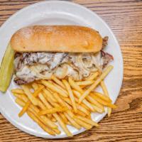 Cheese Steak · Thin sliced Rib Eye steak with provolone cheese, sautéed onions, and homemade queso alfredo ...