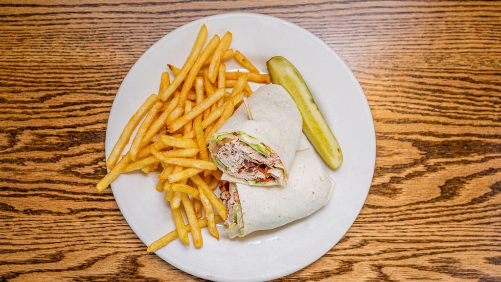 Chicken Bacon Ranch · Rotisserie chicken with provolone cheese, bacon, lettuce, tomato, and ranch! Served as a wrap or on a delicious hoagie bun!