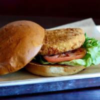 Crispy Chicken Sandwich · Breaded and fried, crispy chicken breast. Served with lettuce & tomato on a toasted white bun.