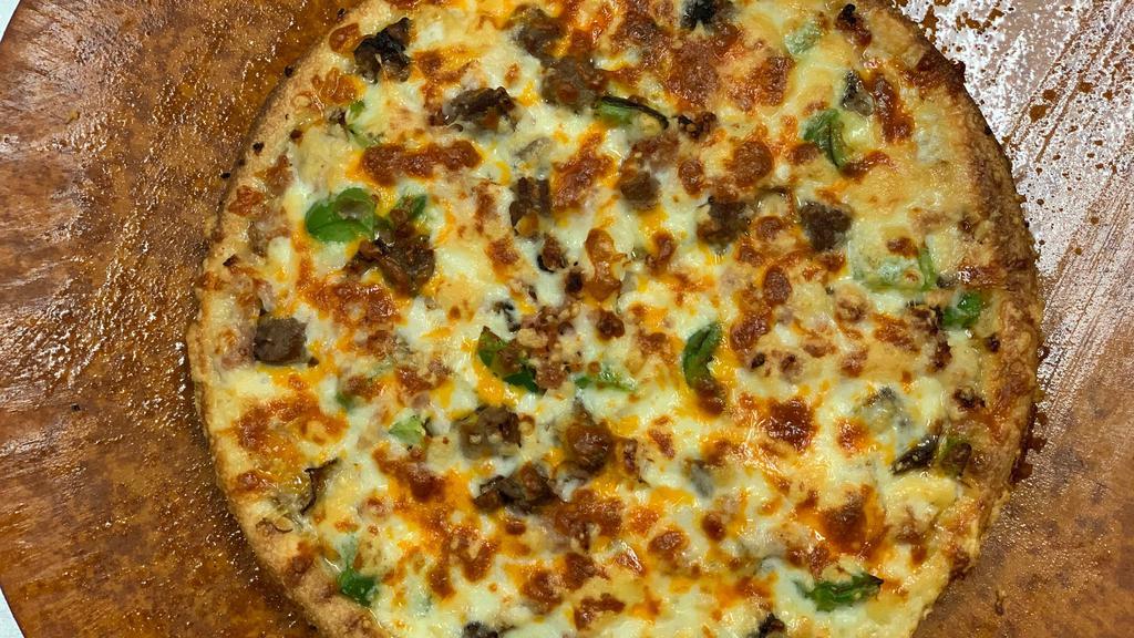 Sarpino'S Steak · Juicy sliced steak, onions, green peppers, fresh mushrooms, our signature gourmet cheese blend smothered in our homemade pizza sauce