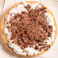 Chocolate Cream · Decadent chocolate pastry cream decorated with whipped cream and hand-shaved Guittard chocol...