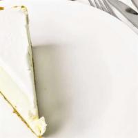 New York Cheesecake · Gloriously smooth, impossibly creamy New York style cheesecake rests in a graham cracker cru...