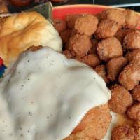 Chicken Fried Chicken · Fried breast topped with white country gravy, with a side of mashed potatoes, your choice of...