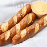 Pretzel Breadsticks · Three pretzel breadsticks with cheese