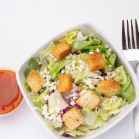 Tossed Salad · Iceburg and Romain tossed with purple cabbage and carrots topped with cheddar jack, croutons...