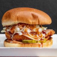 Mississippi Flyer  · Fried chicken breast, swiss cheese, coleslaw, tomato, pickles, BBQ sauce served on butter bun.