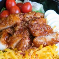 Crunchy Bbq Chicken Salad · Crunchy BBQ chicken, tomatoes, cucumber, egg, shredded cheddar cheese, and topped with crumb...