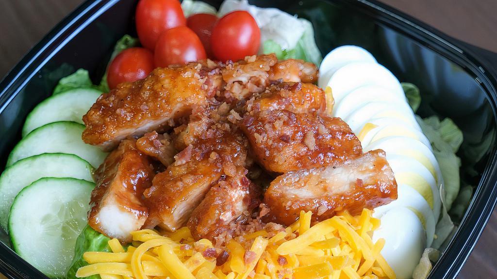Crunchy Bbq Chicken Salad · Crunchy BBQ chicken, tomatoes, cucumber, egg, shredded cheddar cheese, and topped with crumbled bacon.