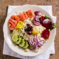 Greek Salad · With lettuce, feta cheese, kalamata olives, pepperoncini, onions, tomatoes, beets and cucumb...