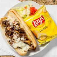 Philly Steak & Cheese · Philly steak with grilled mushrooms and onions and swiss, topped with lettuce and tomato. Se...