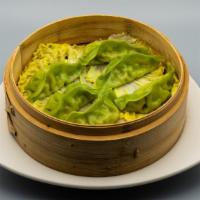 Steamed Dumplings · Steamed chicken or vegetable dumplings with dumpling dipping sauce.