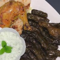 Dawalee /  دوالي · Juicy and delicious grape leaves stuffed with seasoned meat and rice comes with a chicken le...