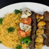 Mixed Grill- Platter · One skewer of each: shish kabob, chicken shish tawook & kufta kabob.  Comes with our seasone...