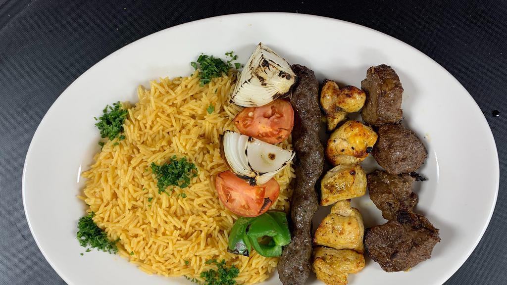 Mixed Grill- Platter · One skewer of each: shish kabob, chicken shish tawook & kufta kabob.  Comes with our seasoned rice and your choice of side salad.