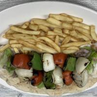 Veggies Shish Kabob Wrap · No meat. Grilled fresh seasonal vegetables, tomatoes, green pepper, and onions, come on a fr...