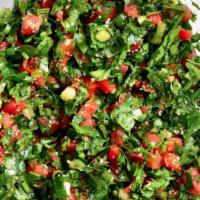 Tabbouleh /  تبولة · Finely chopped parsley with cracked wheat, diced tomatoes, tossed in lemon juice and extra v...