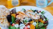 Sanibel Chicken Salad · Strawberries, blueberries, Mandarin oranges, blue cheese, and pecans with poppy seed dressing.