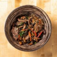 Japchae · Marinated beef, stir-fried carrots, red peppers, spinach, Korean glass noodles, sesame seeds...