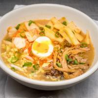 Spicy Pork Ramen · house-braised pork shoulder, bamboo shoots, spicy kimchi, topped with a hard-boiled egg in p...