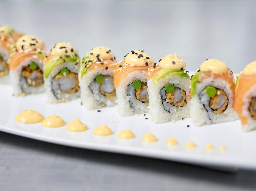 Crunchy Shrimp Roll · shrimp tempura, sliced avocado, seared asparagus, topped with tempura flakes, finished with a rich spicy mayo, a sweet teriyaki sauce, and toasted sesame seeds (8 pc)